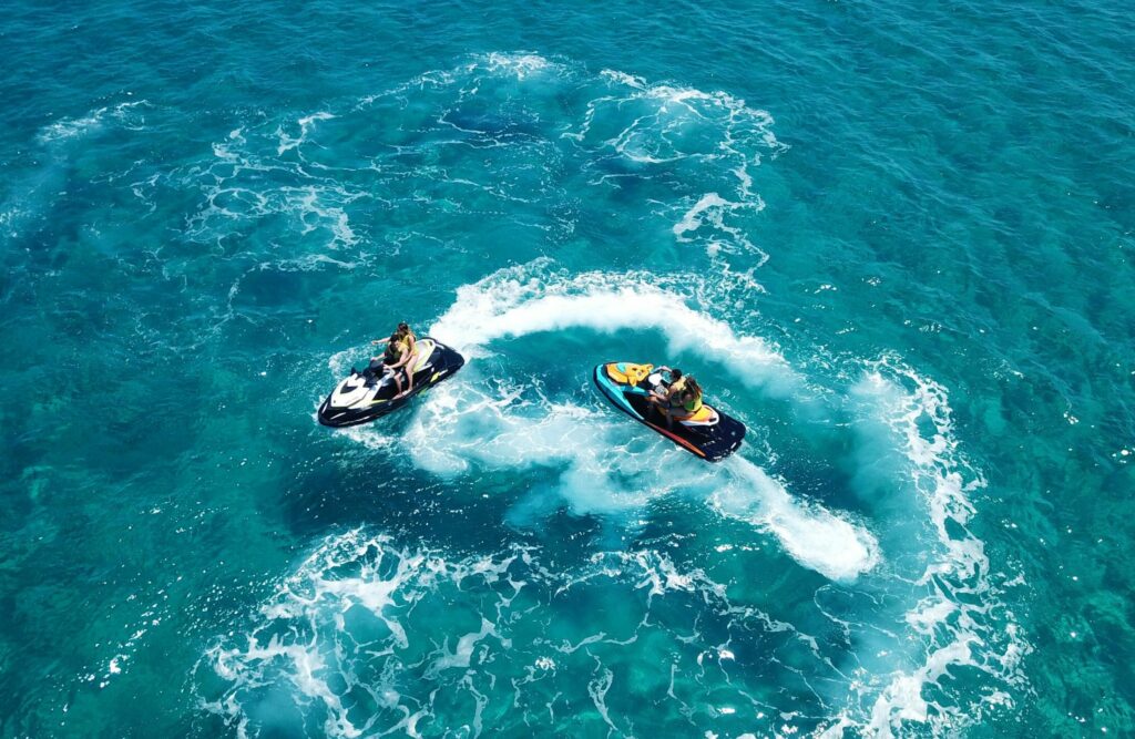 Aerial,Drone,Top,View,Of,2,Couple,On,Jet,Ski