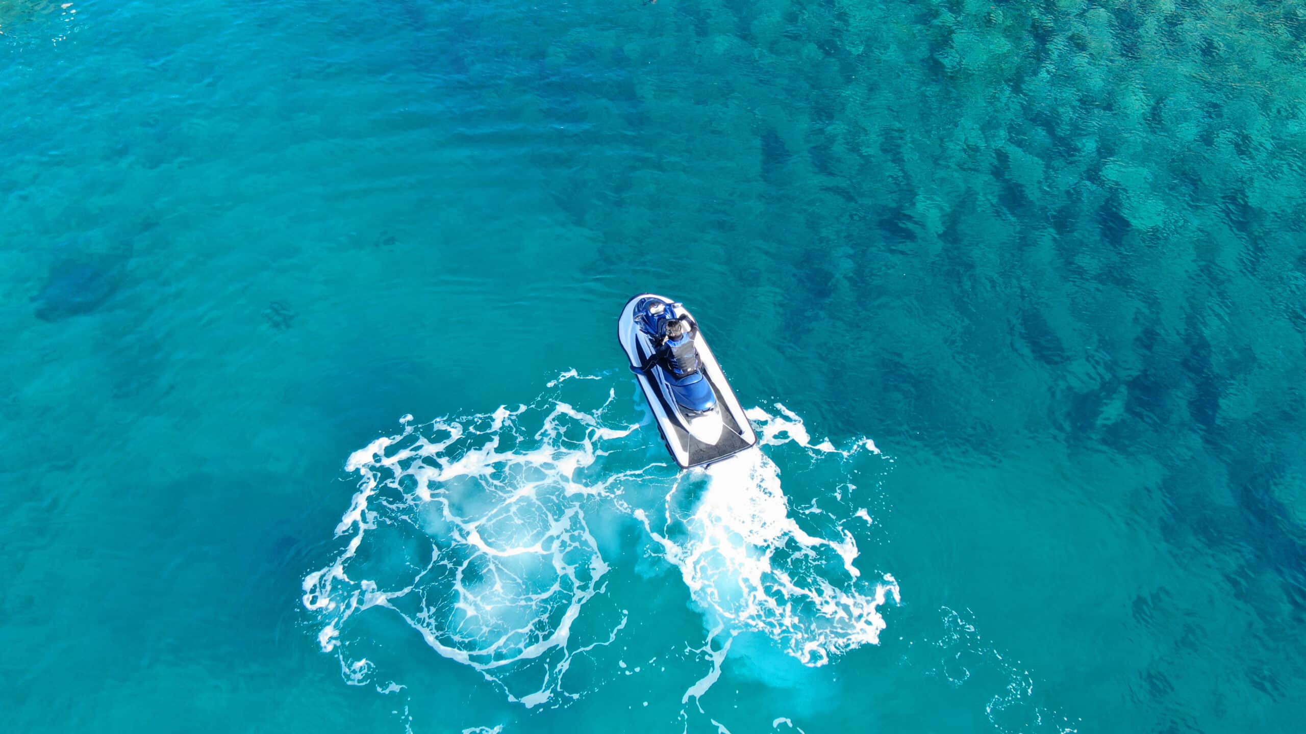 Aerial,Top,View,Of,Jet-ski,Cruising,In,Low,Speed,In