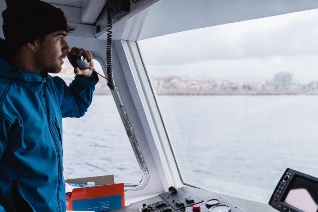 Young,Captain,Man,Sailing,Vintage,Boat,While,Working,During,Holiday